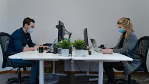 two people sitting in office