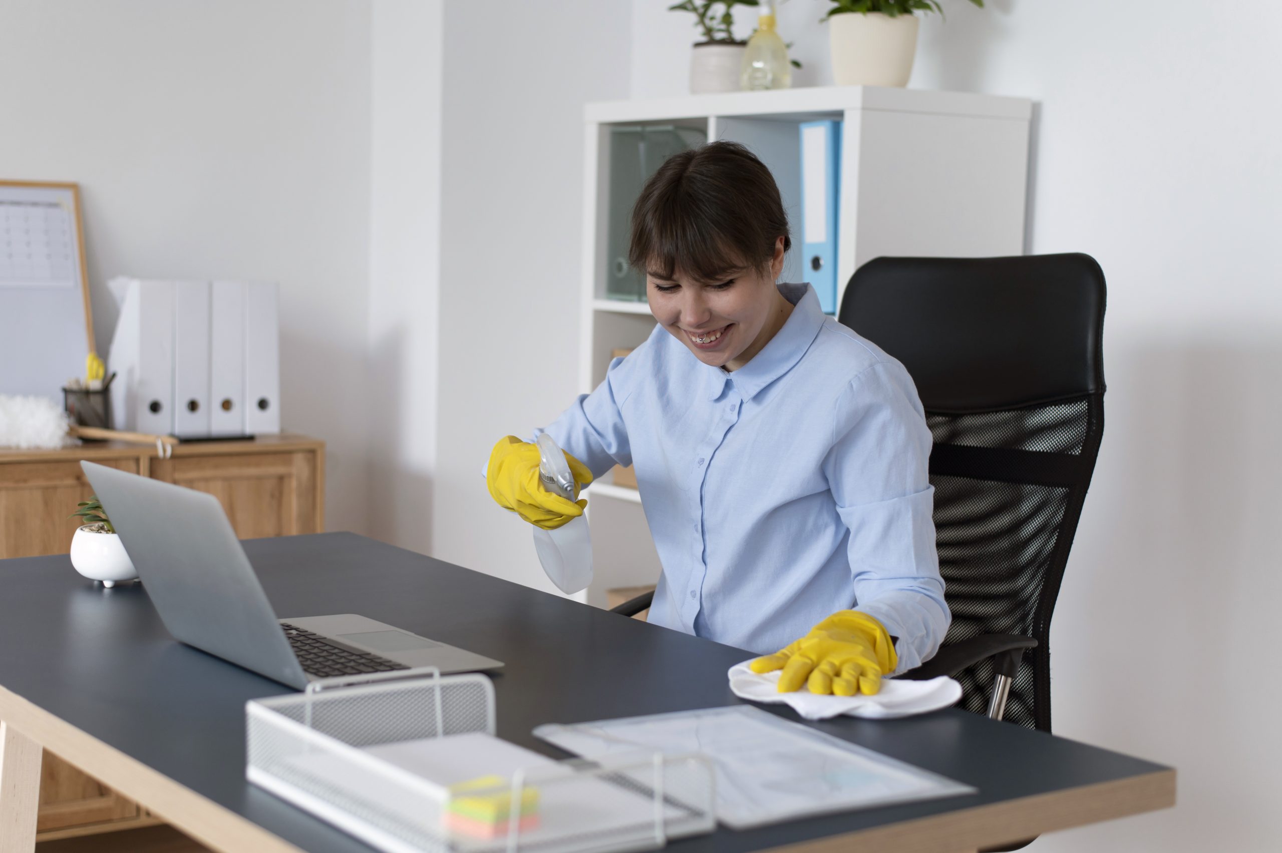 Cleaner sanitizing a desk